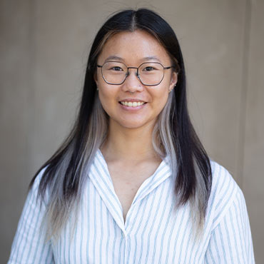 Cathy Wang headshot with striped shirt